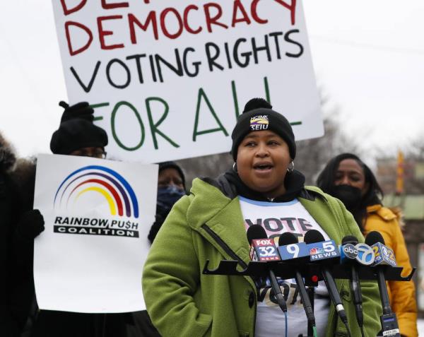 Erica Bland-Durosinmi, executive vice president of the regio<em></em>nal SEIU Healthcare chapter that includes Illinois, joins others as they rally for voting rights in 2022. 
